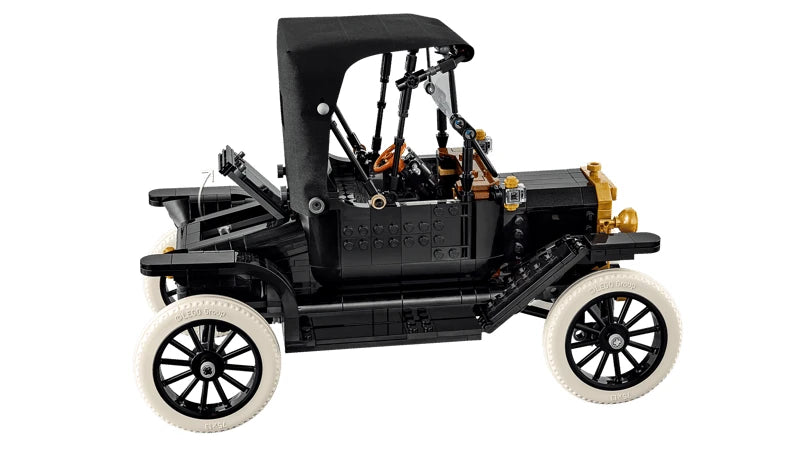 Side view of the LEGO Icons Ford Model T with the rear lid raised, black fabric roof, orange steering wheel and white tyres