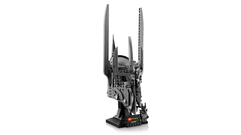 Angled side view of LEGO Icons Sauron’s Helmet model on black display stand with Sauron minifigure holding a gold ring