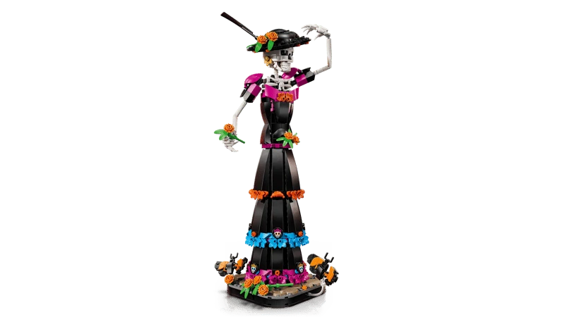 LEGO Ideas La Catrina 21372 figure touching the decorated hat while holding an orange flower