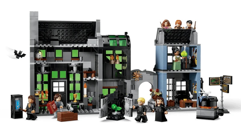 LEGO Harry Potter wizarding shops with black and green shop fronts, minifigures, cauldrons, signposts and accessories