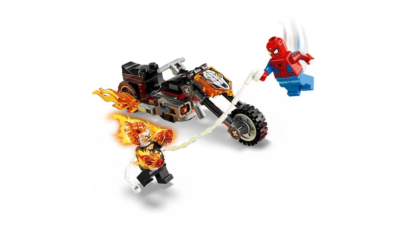 Action scene showing the Ghost Rider motorcycle with flame tailpipes and stud shooters, Ghost Rider minifigure riding the bike, and Spider-Man minifigure swinging on a white web rope attached to the motorcycle