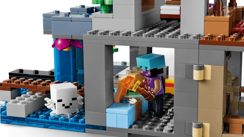 LEGO Minecraft cave interior with ghast figure, bed, chest and skeleton skull