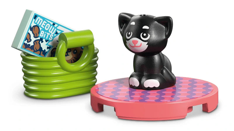 LEGO kitten figure beside a pet bed and Meow Bits food pack