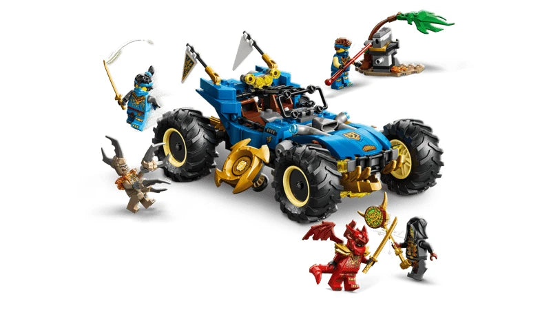 Blue and gold LEGO NINJAGO off road car with four large tyres and white flags, shown with a small grey and green side build holding a red dart shooter, plus five minifigures posed around the vehicle