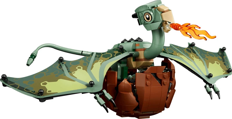 Green LEGO baby dragon hatching from a brown egg