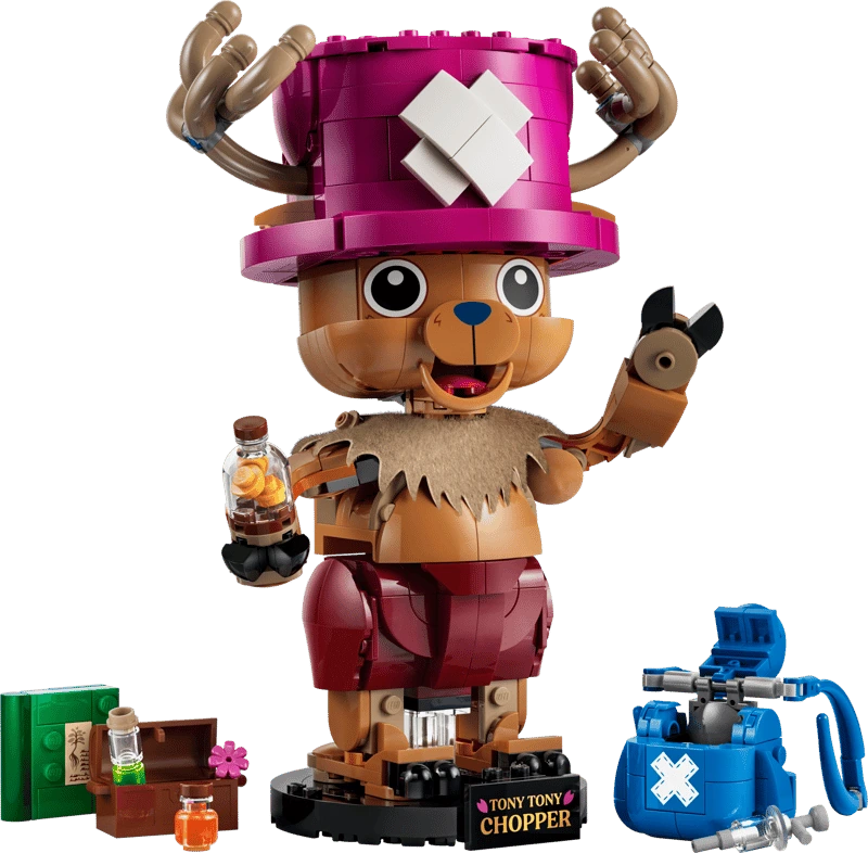 Completed LEGO One Piece Tony Tony Chopper 75643 model holding a bottle beside a blue backpack and small accessories
