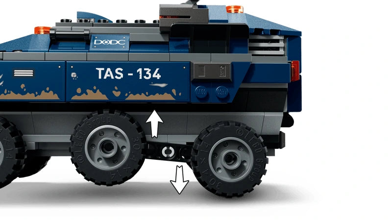 Side view of a LEGO blue prison transport vehicle showing wheel suspension with arrow markers