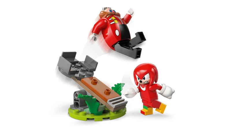 Knuckles standing beside the green and brown catapult as it launches Dr. Eggman into the air