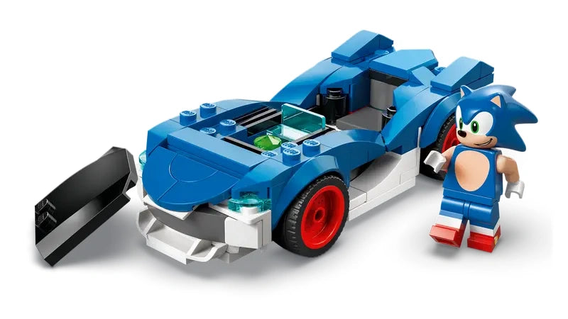 Blue LEGO Sonic Speedster Lightning race car with red wheels shown with the hood open and the Sonic minifigure standing beside it on a white background