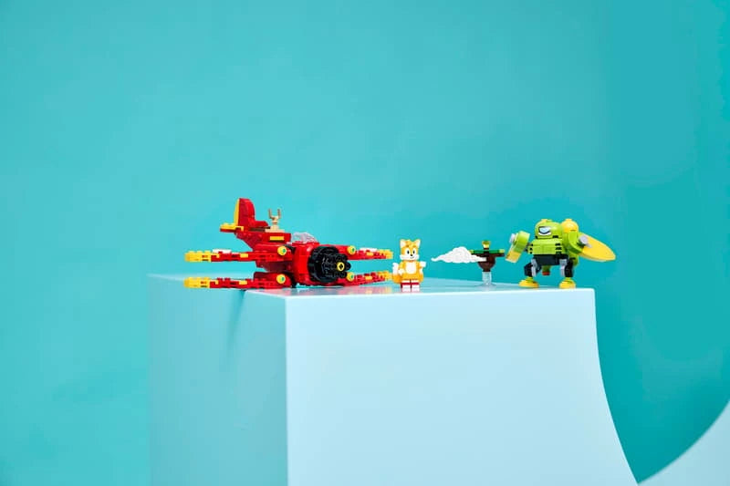 LEGO Sonic the Hedgehog Tails' Tornado-1 77119 biplane, Tails, Egg Chaser and floating island displayed on a blue plinth