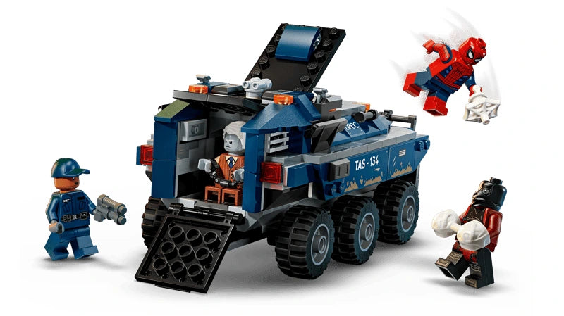 LEGO Spider-Man prison transport chase scene with blue armoured vehicle, Spider-Man, two minifigures and web pieces