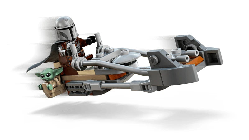 LEGO Star Wars speeder bike shown in a riding pose with The Mandalorian seated at the controls and Grogu positioned in the side satchel, with motion effect elements behind the vehicle