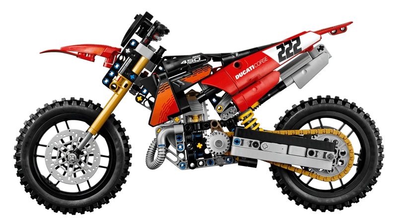 Side profile of the LEGO Technic Ducati Desmo450 MX Factory Motorcycle 42238 showing the red bodywork, chain and knobbly tyres
