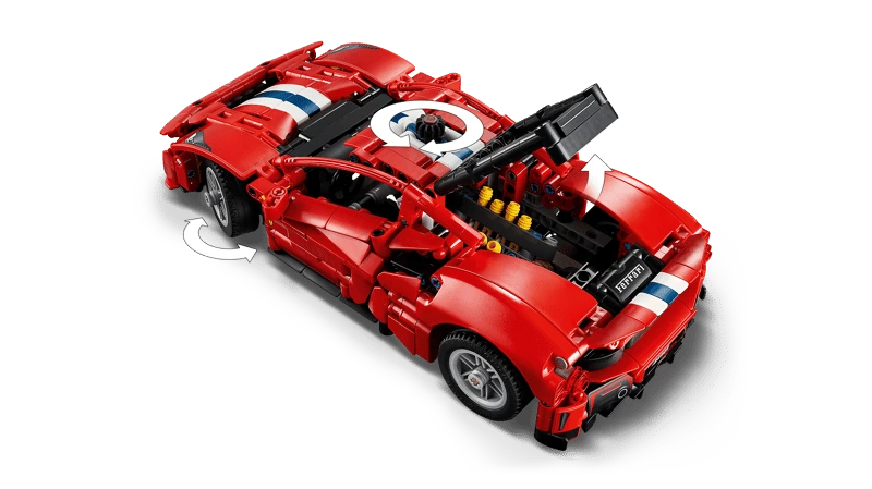 LEGO Technic Ferrari 488 Pista Car 42235 viewed from above with raised body panels and arrows showing wheel movement and the top control