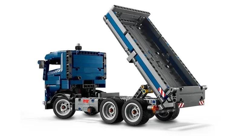 Rear side view of LEGO Technic Tipping Dump Truck tipping its bed to show detailed mechanism and moving parts in Ireland.