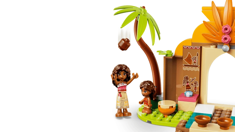 LEGO Moana and Simea figures beside a palm tree and village house section