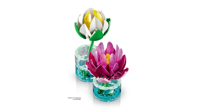 Angled view of LEGO Water Lilies with white flower behind pink flower in transparent blue bases