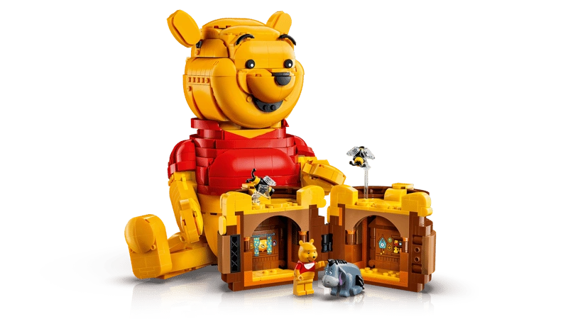 LEGO Winnie the Pooh 43300 with the Hunny pot opened to reveal 2 interior rooms, plus small Winnie the Pooh and Eeyore figures in front