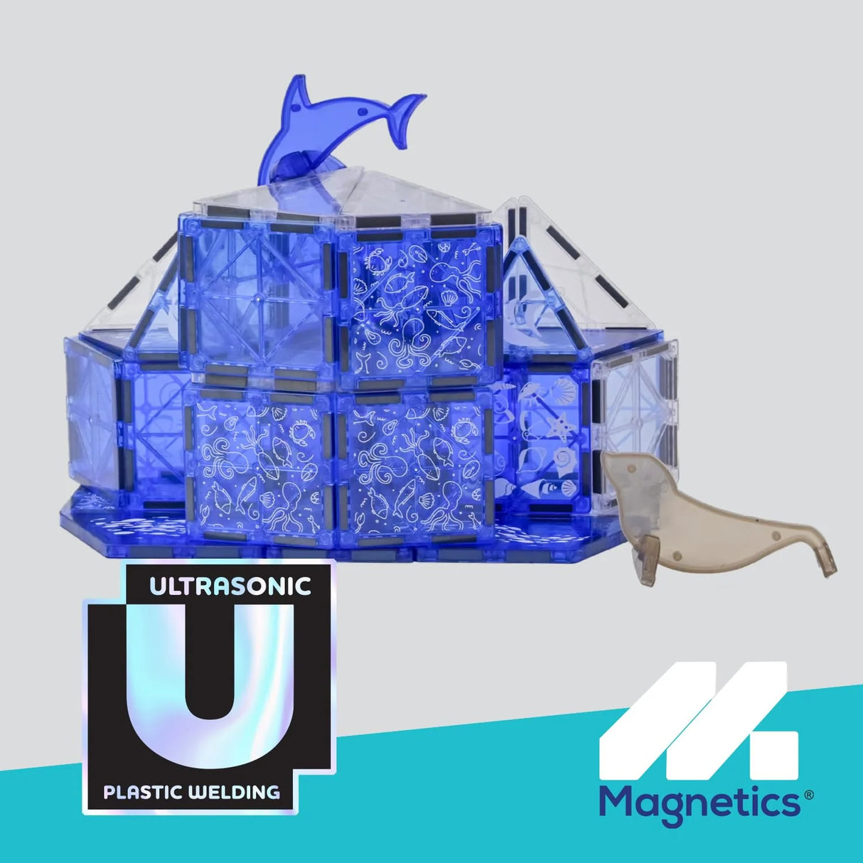Magnetics Sea Life Expansion Set built with translucent blue magnetic tiles featuring dolphin and seal figures on display