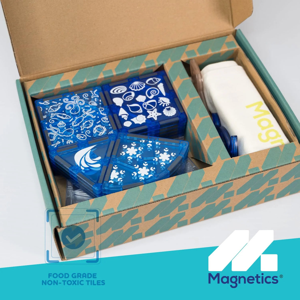 Open Magnetics Sea Life Set box showing decorative blue tiles with marine patterns and branded storage bag inside packaging