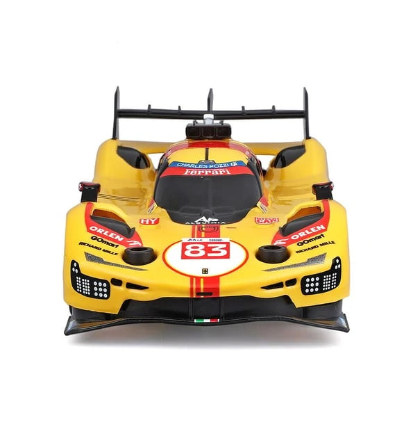 Overhead view of the yellow Maisto Tech Ferrari 499P racing car showing its black central cockpit, wide yellow bodywork and rear wing.