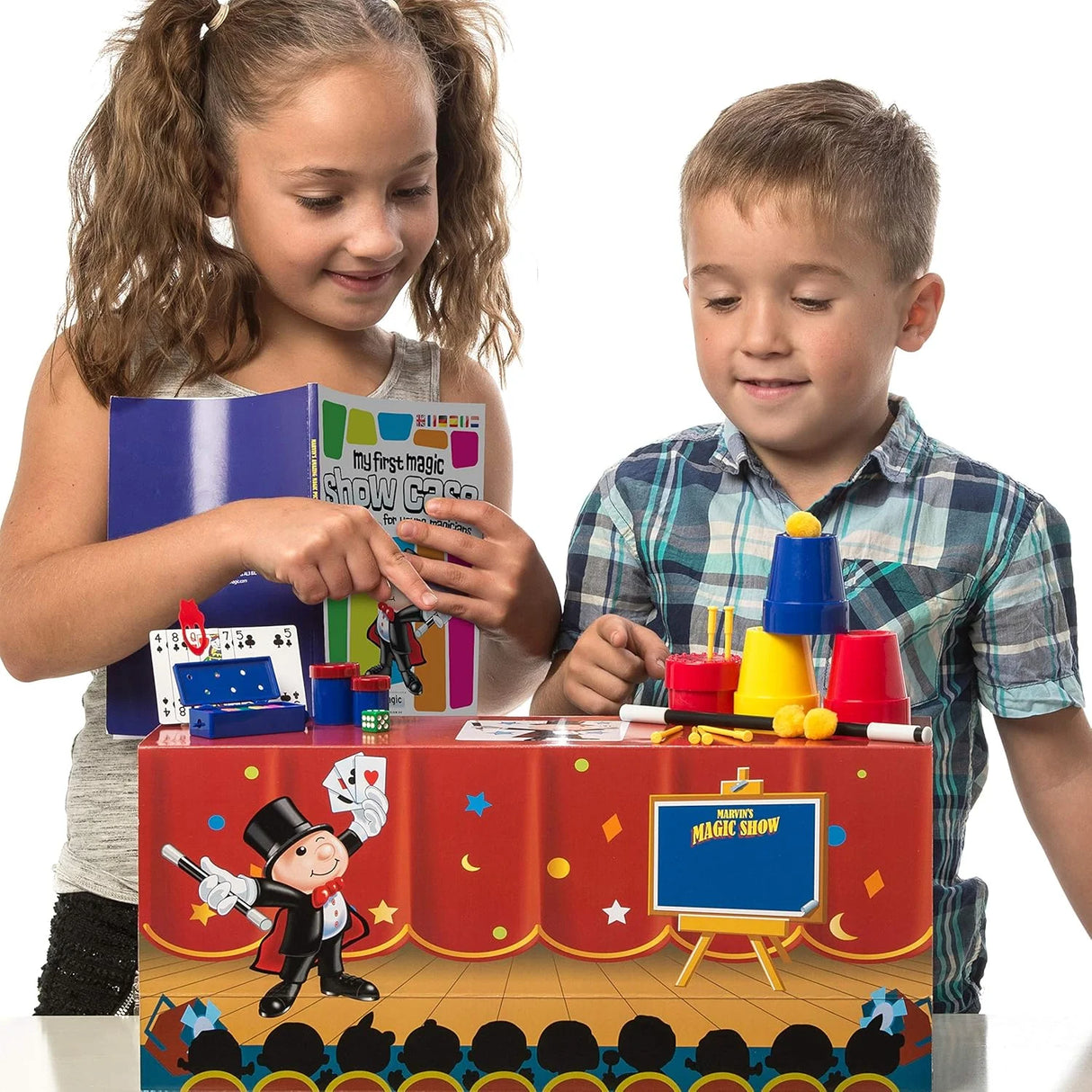Children playing with Marvin’s Magic Show Case set and instruction booklet – Ireland