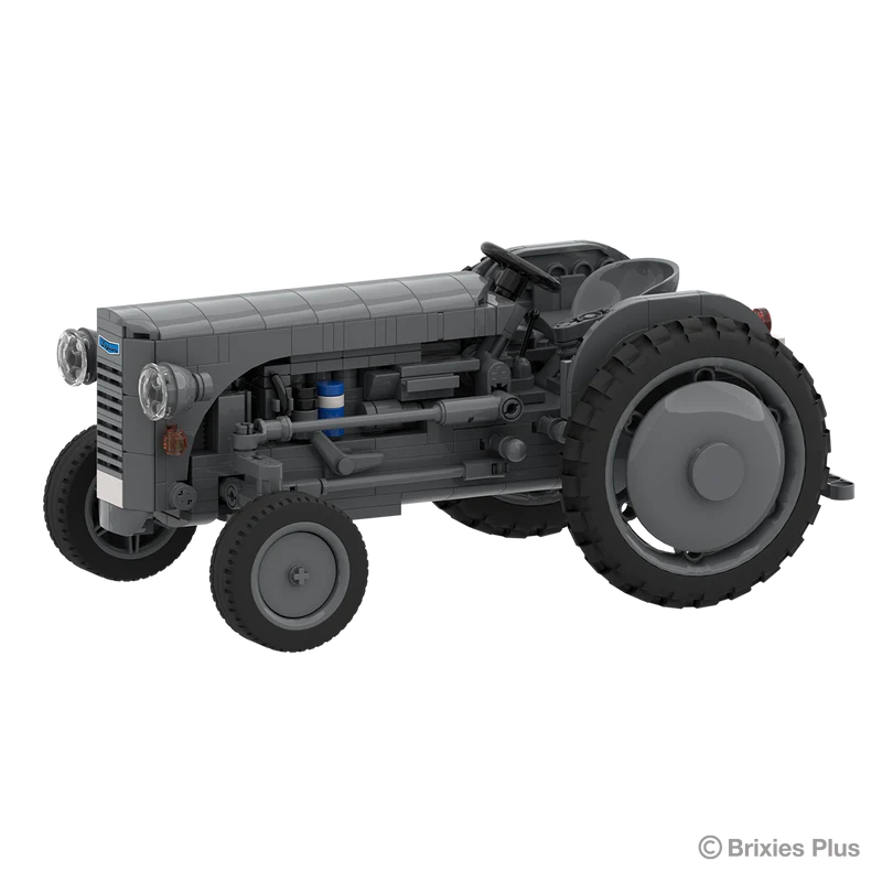Front angled view of the BRIXIES Plus Massey Ferguson TEA 20 showing the grey bonnet, round headlights, exposed engine details and front wheel
