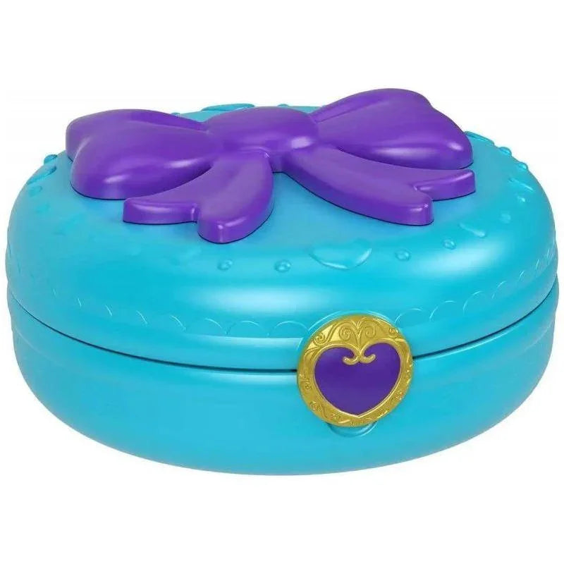 Closed Polly Pocket birthday compact with purple bow and gold clasp – Ireland