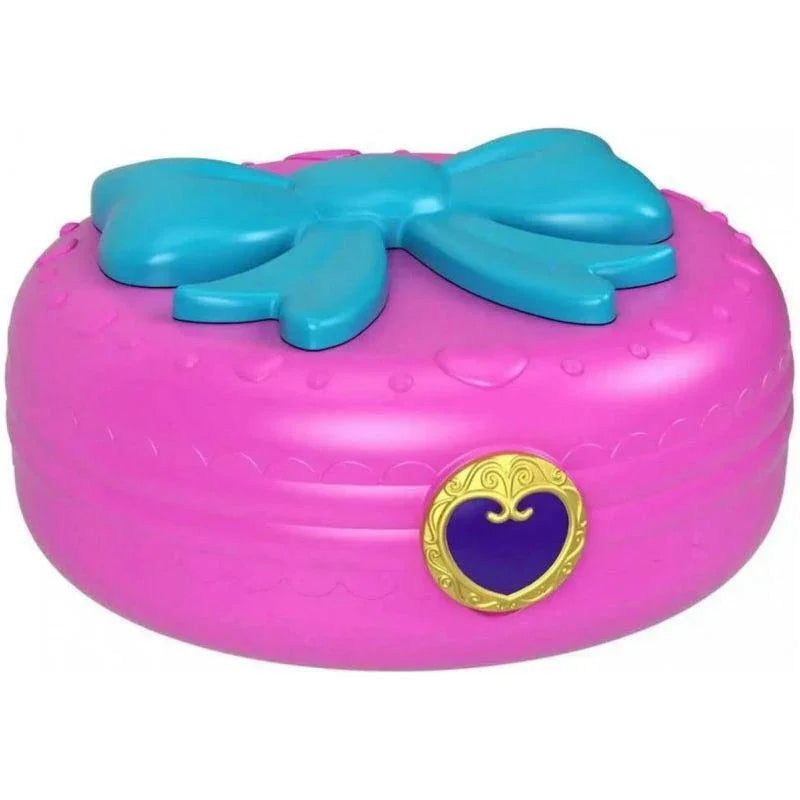 Closed pink Polly Pocket compact with blue bow and gold heart clasp – Ireland