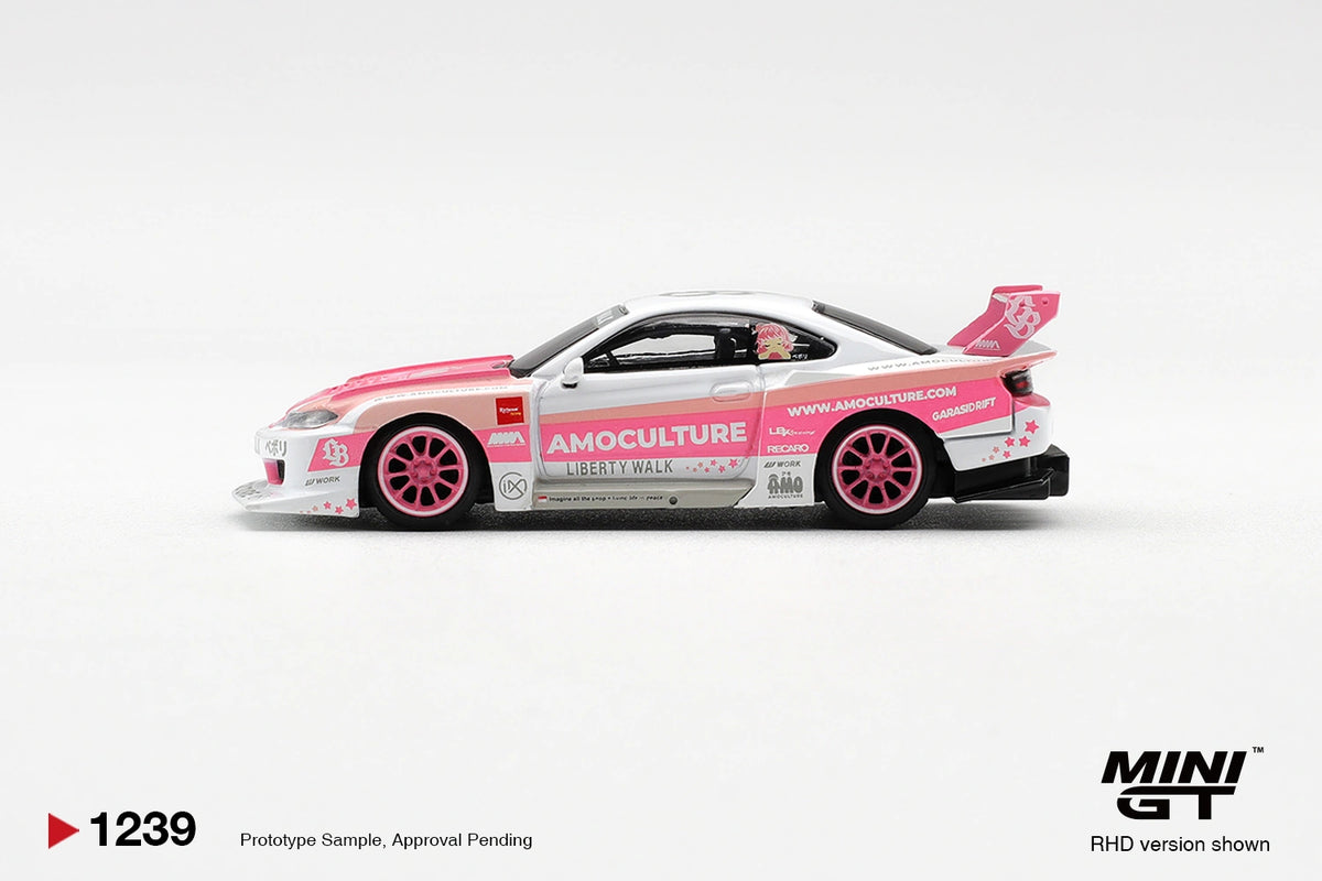 Side profile of Mini GT Nissan Silvia S15 LB Super Silhouette Amoculture showing pink wheels, Amoculture and Liberty Walk graphics, wide bodywork and large rear wing