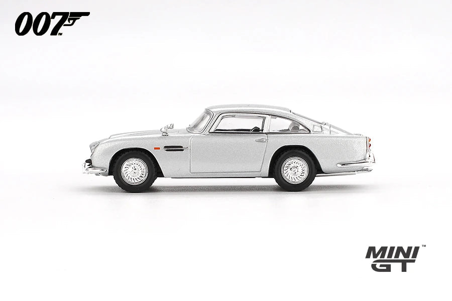 Mini GT James Bond Skyfall Aston Martin DB5 Battle Damaged RHD side profile with silver body