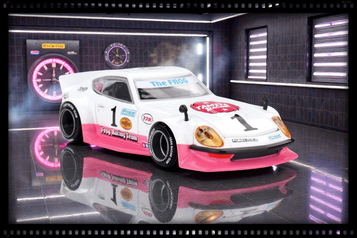 Mini GT Nissan Fairlady Z Tamiya x Kaido House The Frog V1 displayed in a miniature garage