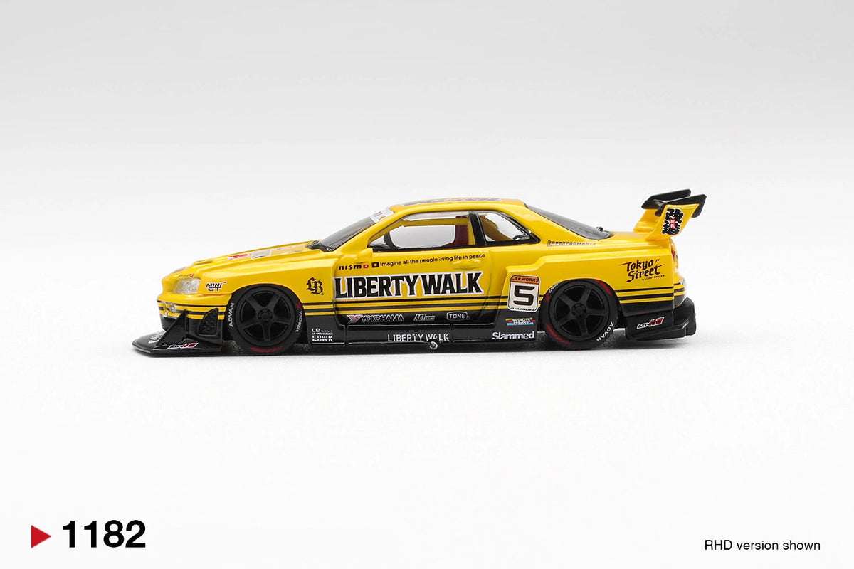 Side profile of Mini GT Nissan LB-ER34 Super Silhouette Skyline Sport Yellow RHD showing Liberty Walk branding, race number 5, black racing wheels, widened bodywork and rear spoiler.