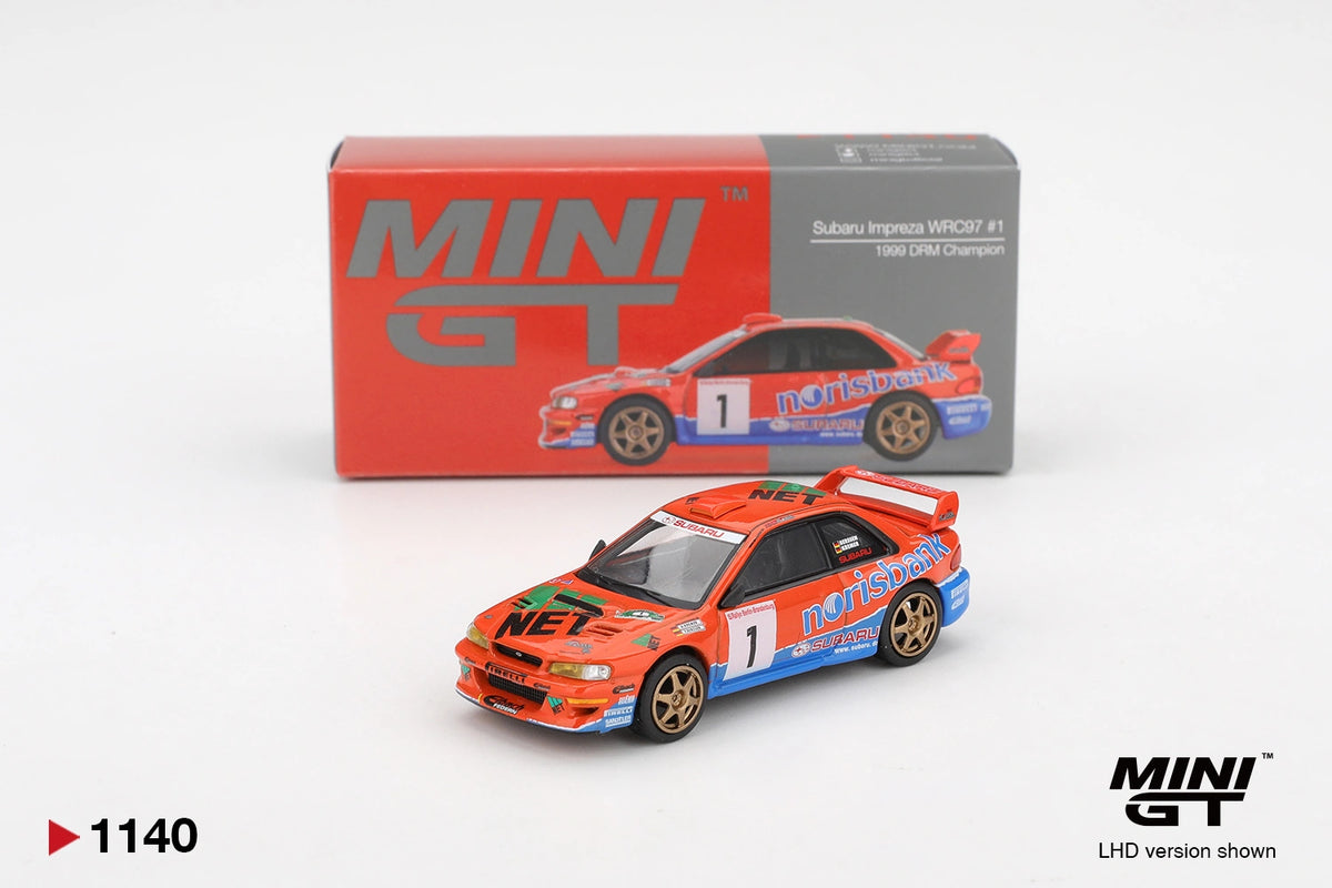 Mini GT Subaru Impreza WRC97 No.1 1999 DRM Champion LHD diecast rally car with orange and blue Norisbank livery, gold wheels and collector box