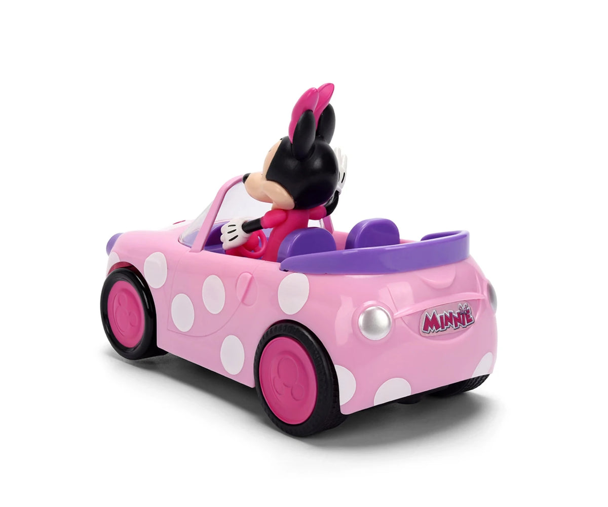 Minnie RC Roadster viewed from the rear and side, showing the pink body with white polka dots, purple seats, pink wheels and Minnie logo on the boot.