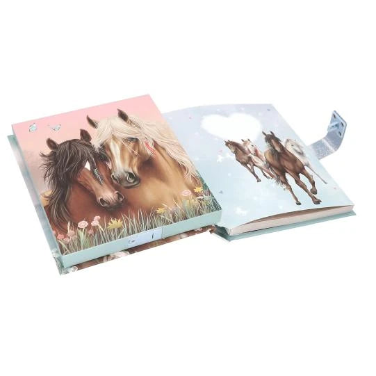 Open Miss Melody diary showing two horses on the left page and running horses on the right page.