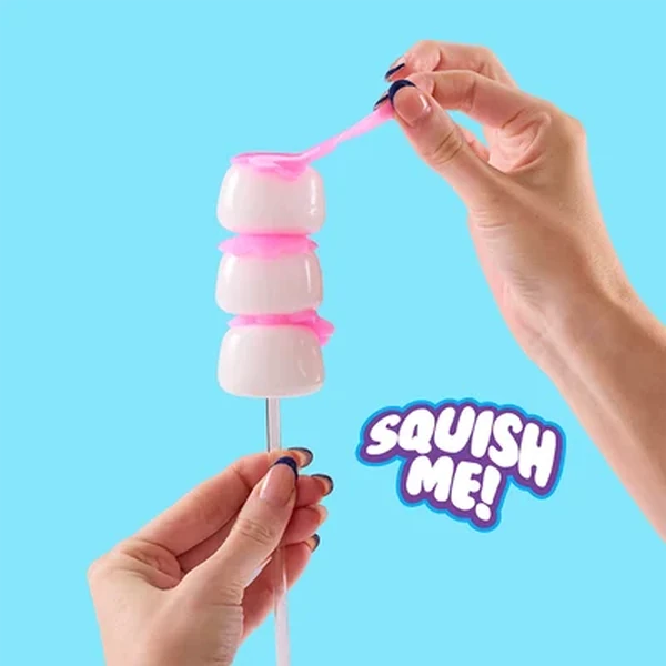 White and pink Mushmeez Sweet Friends stacked Taba squishy being stretched by hand