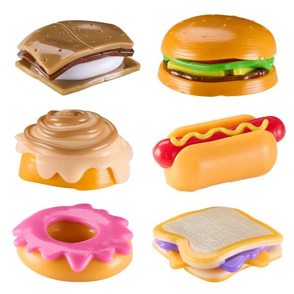 Mushmeez Taba Squishy assortment showing s'more, burger, cinnamon roll, hot dog, doughnut and sandwich designs