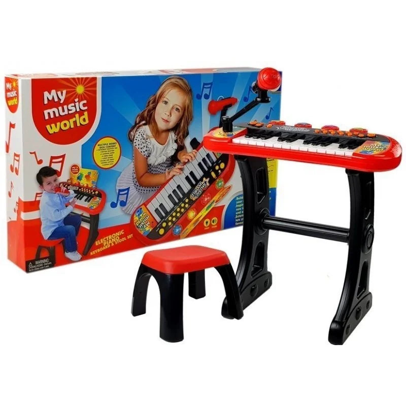 My Music World electronic keyboard set displayed beside the retail box with stool microphone and stand