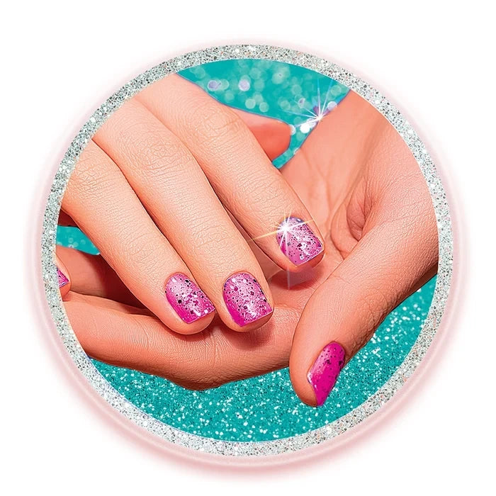 Close view of fingernails decorated with pink and purple glitter polish.