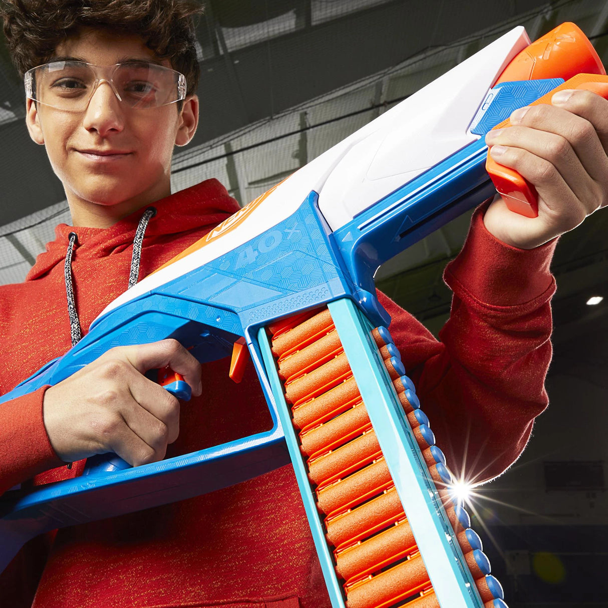 Close-up of person wearing safety glasses holding NERF N Series Infinite blaster