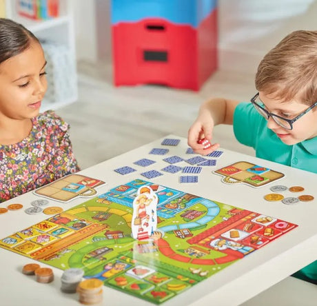 Children playing Pop to the Shops board game by Orchard Toys in Ireland