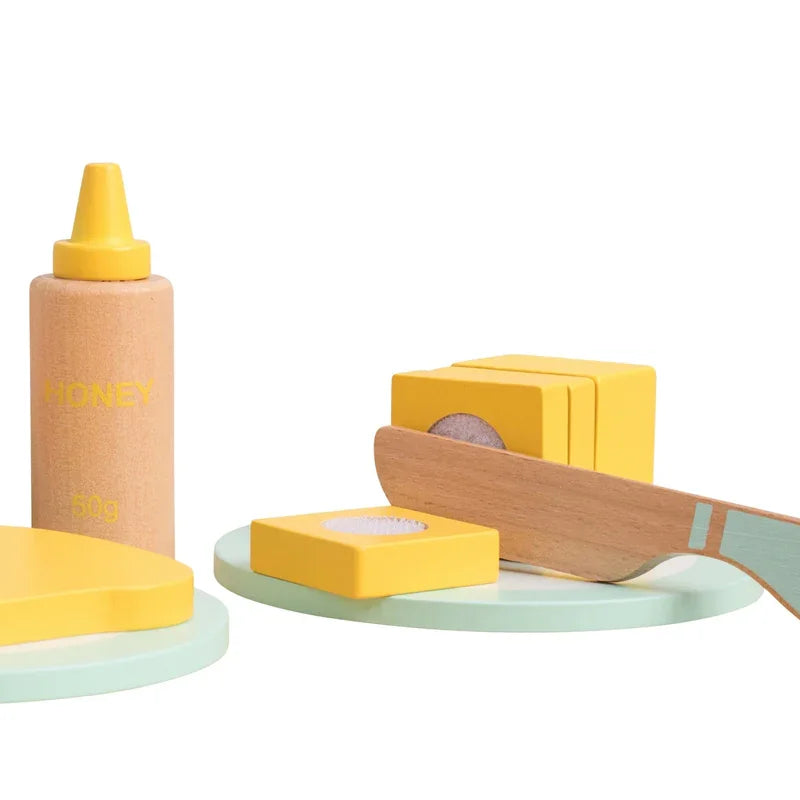 Close-up of Owl and Fox pretend butter, honey and wooden knife from toaster set – Ireland