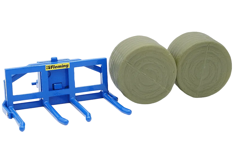 front view of a Britains Fleming Double Bale Lifter 1:32 with blue body and two round bales to the right, shown on a white background.