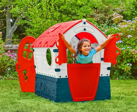 Child playing in Palplay Dream House Playhouse in the garden – Ireland