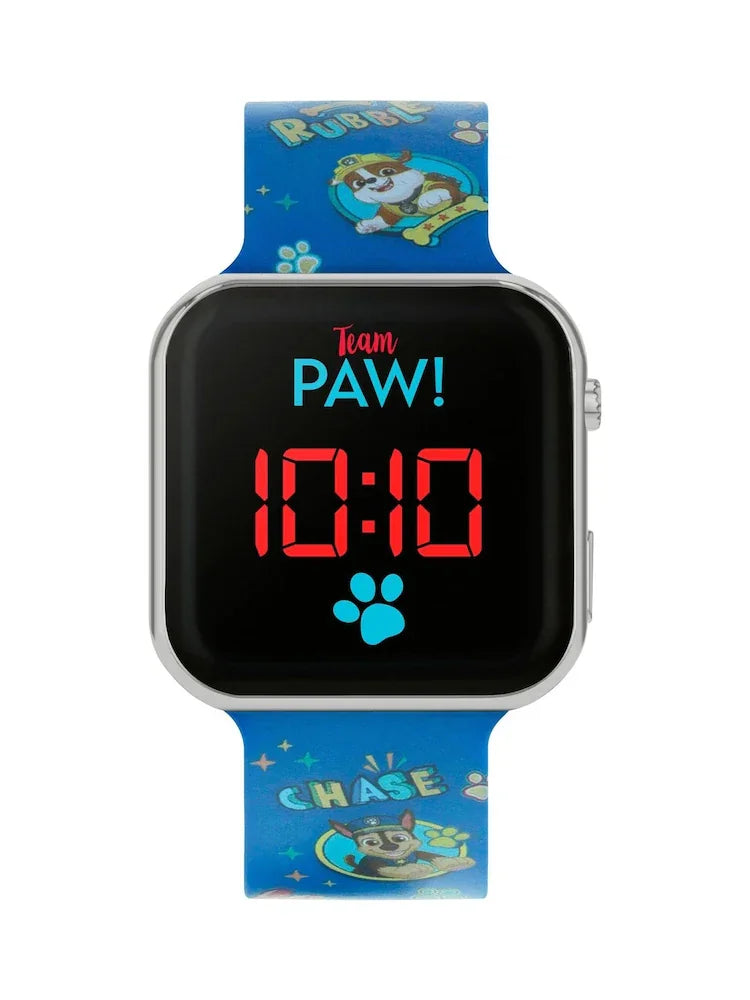 Close-up of PAW Patrol LED watch face with Team PAW! logo and bright red digital time on black dial in Ireland.
