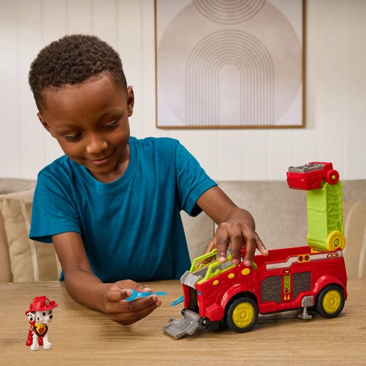 Child playing with the PAW Patrol Dino Rescue Responder vehicle, Marshall figure and blue projectile