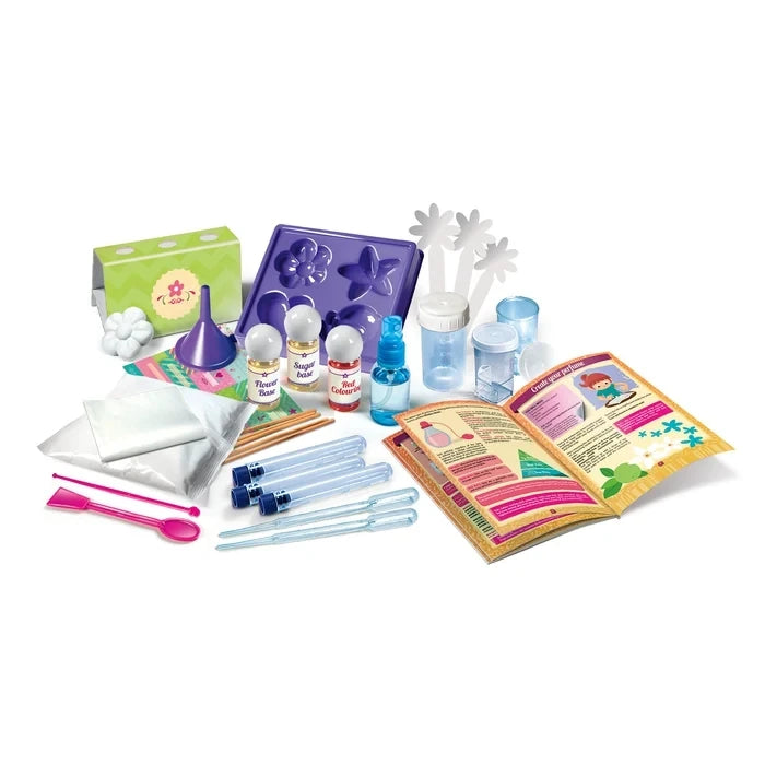 Perfume Creator kit contents with bottles, containers, pipettes, spoon, funnel, mould tray and open instruction booklet.