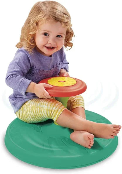Toddler playing on Playskool Sit 'n Spin toy while spinning the handle in Ireland