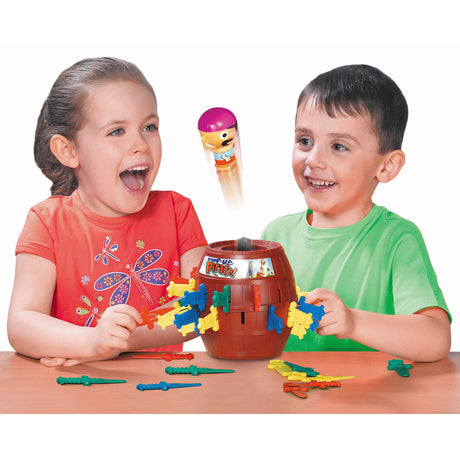 Children playing Pop Up Pirate game as the pirate pops from the barrel